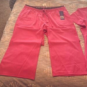 New with tags.  Heartsoul scrubs size Large.  Color pink.